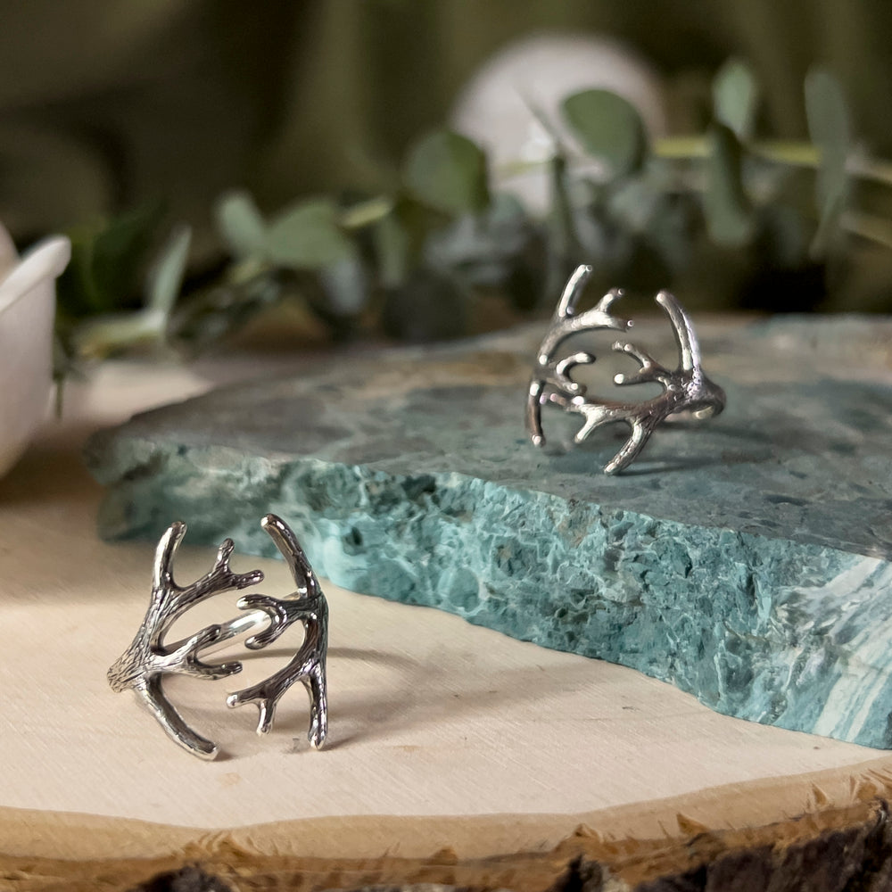 Adjustable silver ring depicting antlers wrapping around your finger.