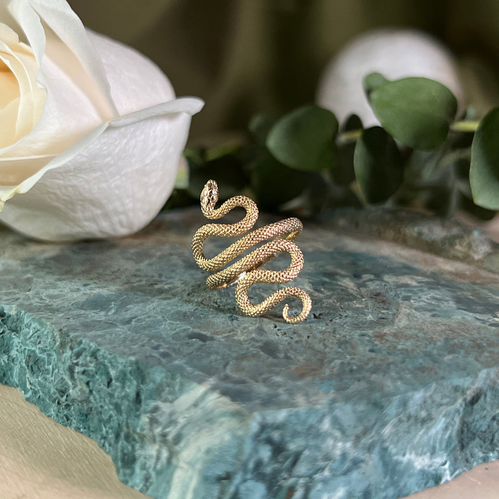 Bronze adjustable snake ring, close up.