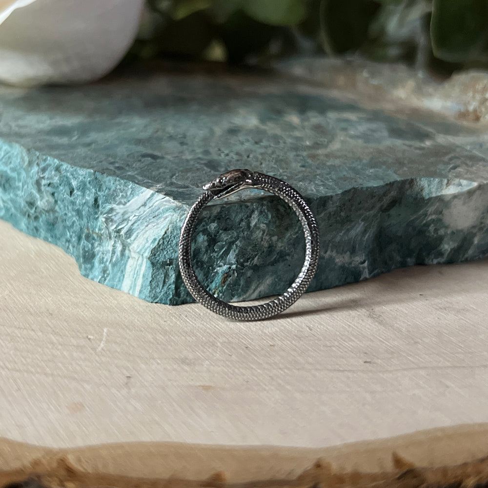 Simple ouroboros ring, a snake circling around and eating it's own tail.