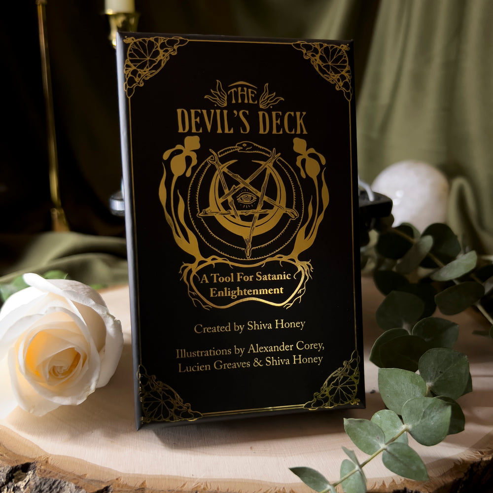 The box of the Devil's Deck, displaying the name, creator and illustrators with gold leaf letters.