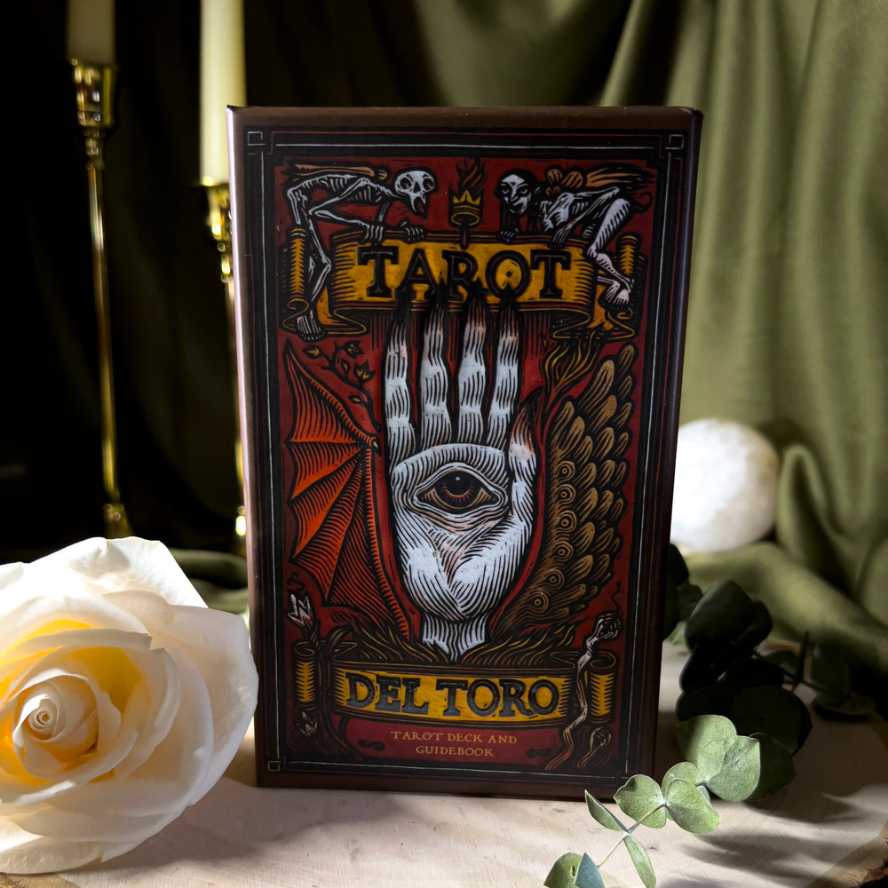 Tarot Del Toro box with the imagery of the Pale Man's hand with an eye in the middle.