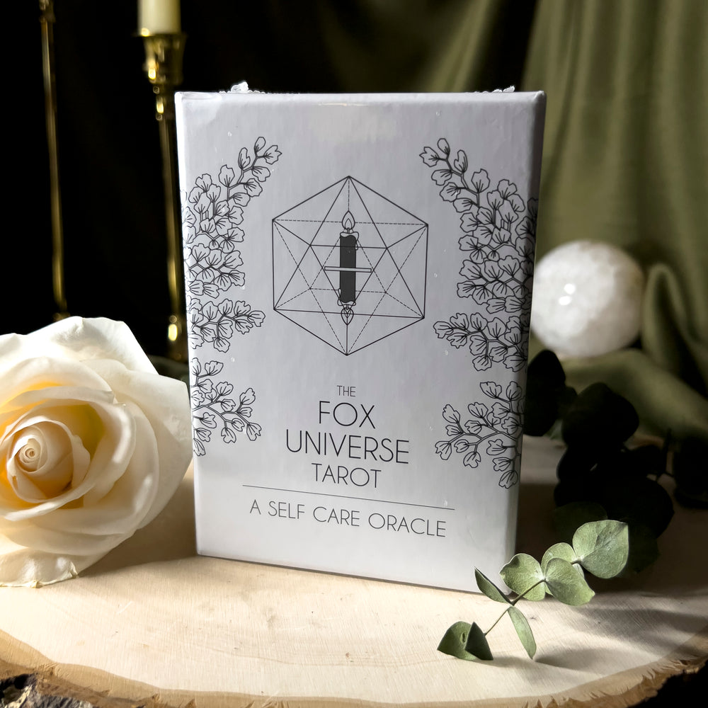 White box with black text for the Fox Universe Tarot: A Self Care Oracle Deck.