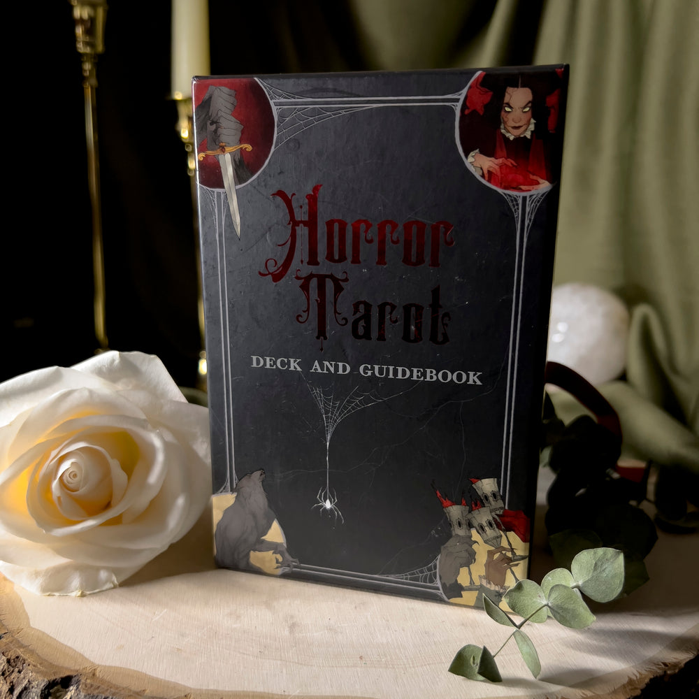Black tarot box with red reflective details reading: Horror Tarot.