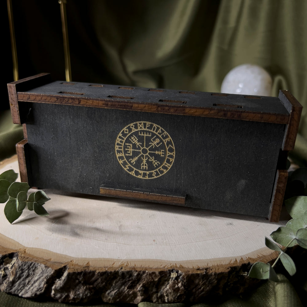 Black wood box with the vegvisir in the center.