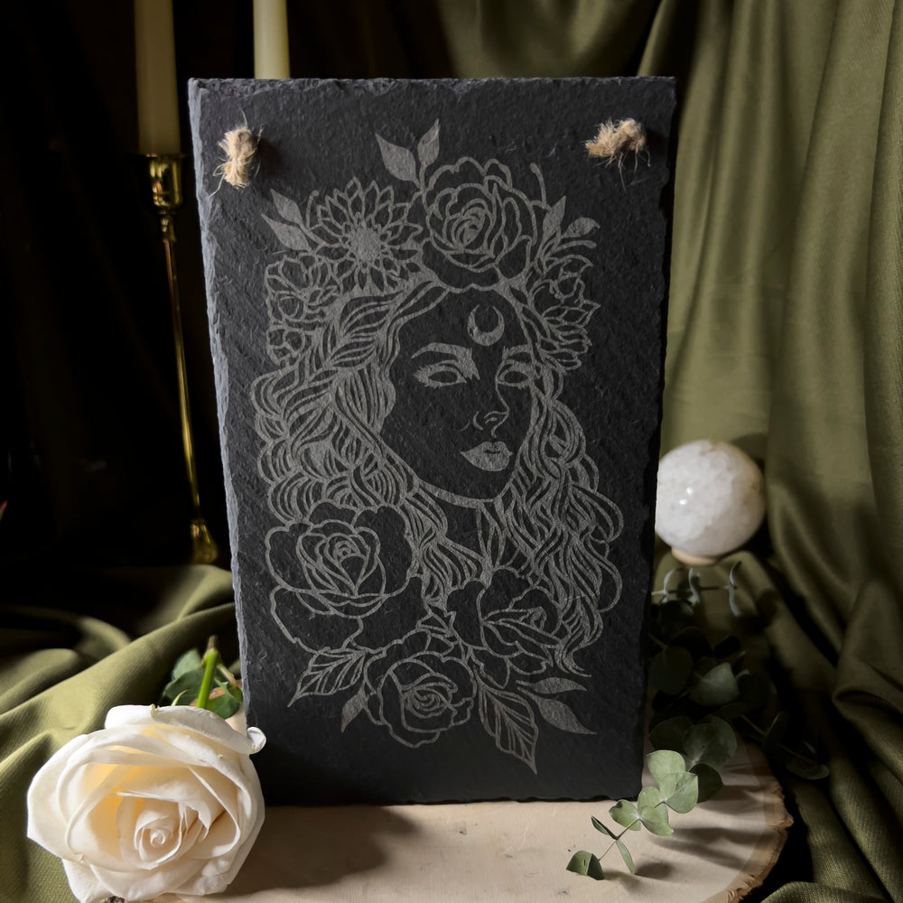 A further back photo of the slate art depicting Aphrodite.