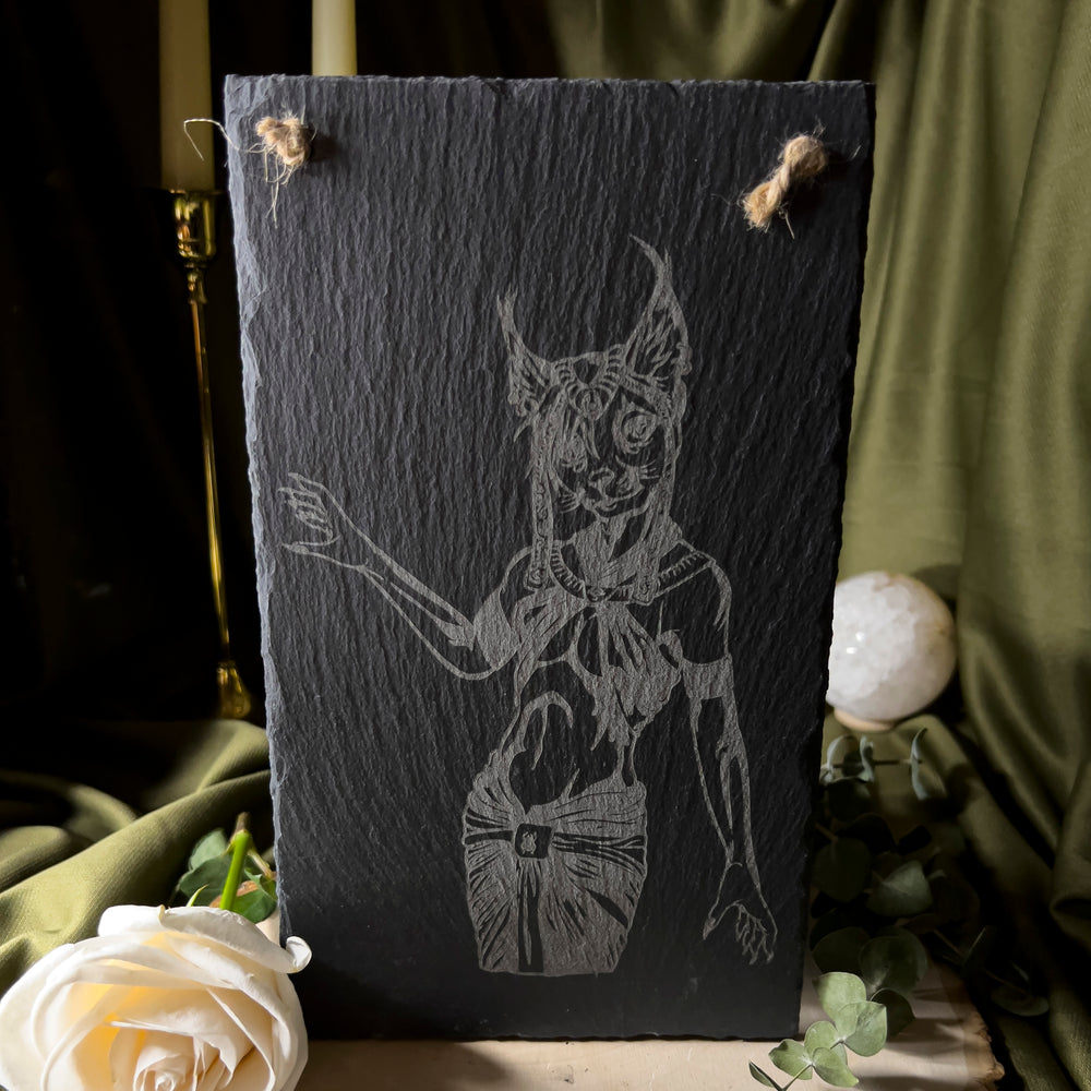 Goddess Bastet depicted on a slate art piece.