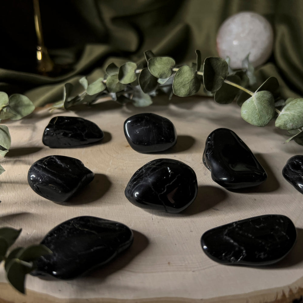 Black tourmaline tumbles, close up.