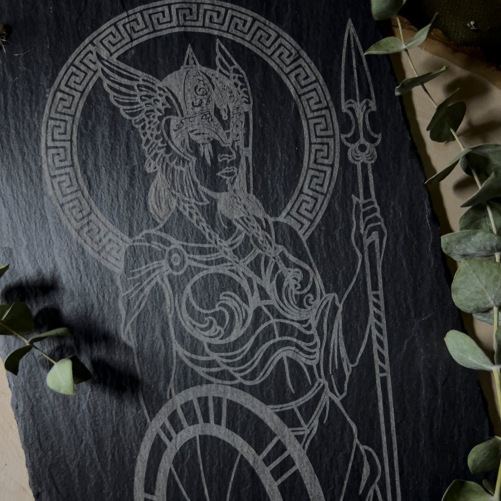 Slate art piece depicting the warrior goddess Athena, close up.