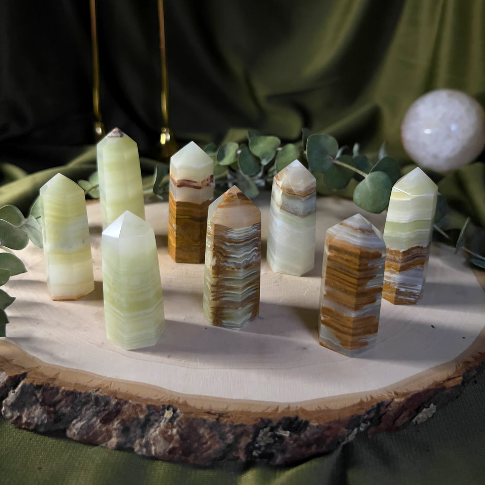Small green onyx towers with brown and white banding.