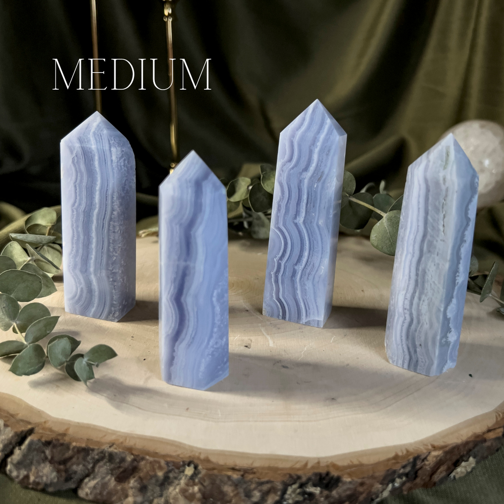 Blue crystal towers with white lace like banding, medium size.